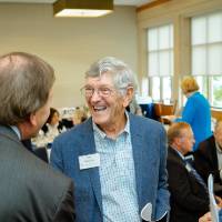 Jim Brooks talking with guests at the Foundation Annual Meeting